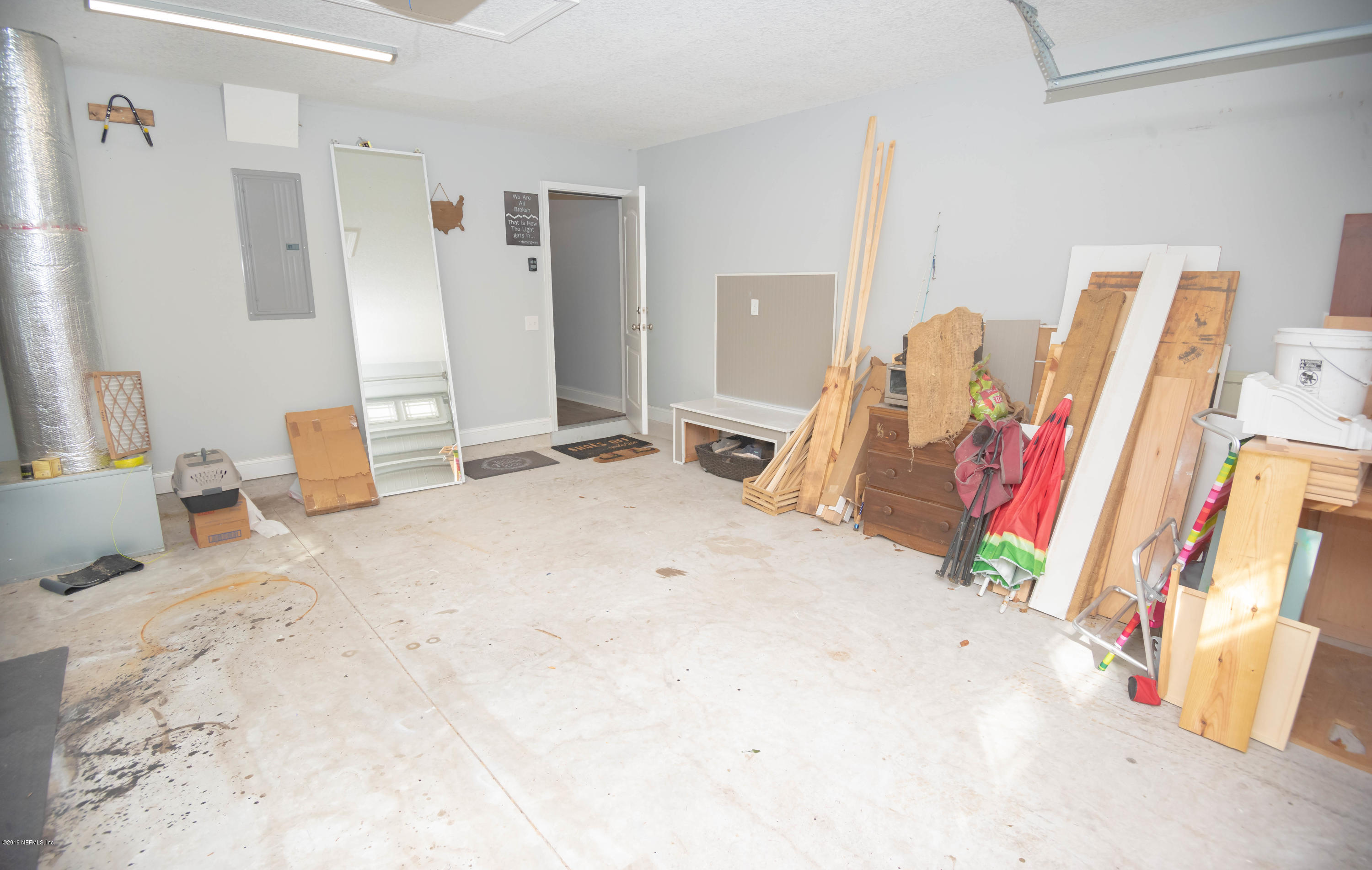 9964 River Oak Circle Glen St. Mary, FL 32040 - Photo 23 of 41 a bedroom with a bed and a large mirror