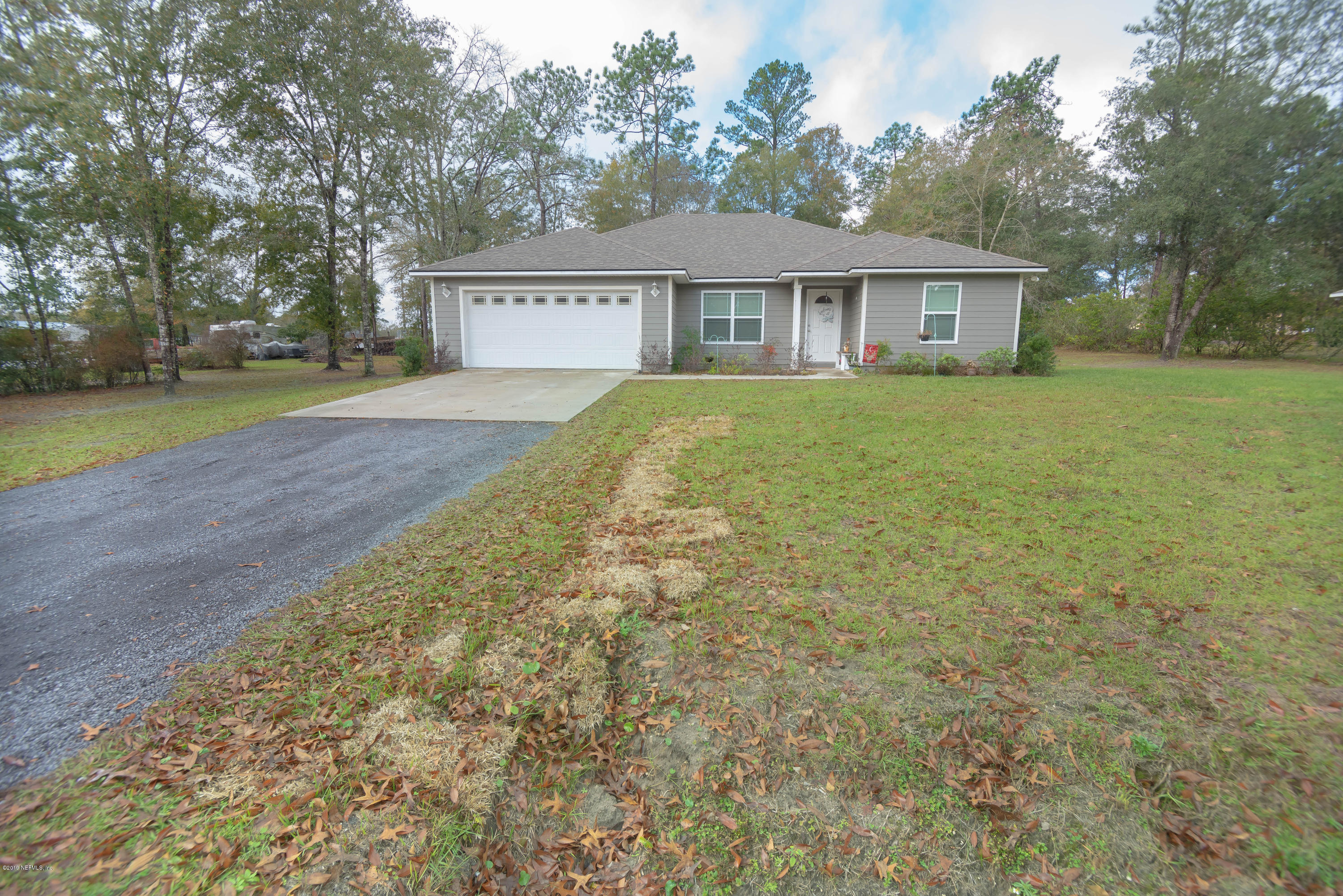 9964 River Oak Circle Glen St. Mary, FL 32040 - Photo 26 of 41 a view of a house with a yard