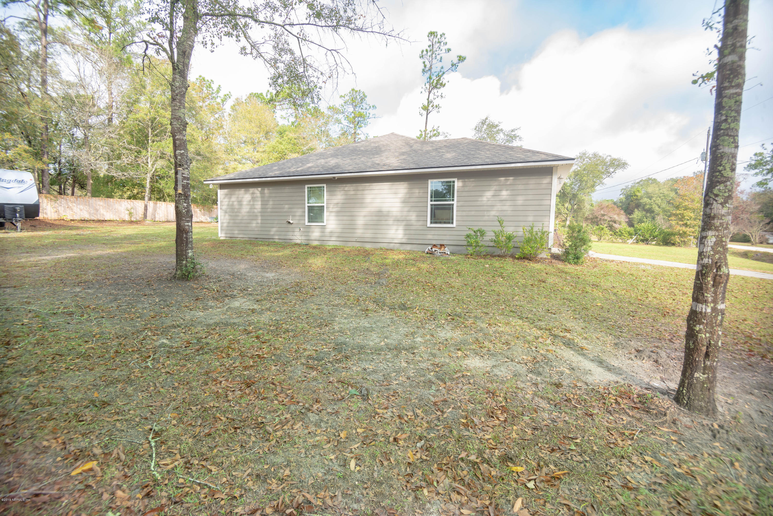 9964 River Oak Circle Glen St. Mary, FL 32040 - Photo 29 of 41 a front view of a house with a yard and garage