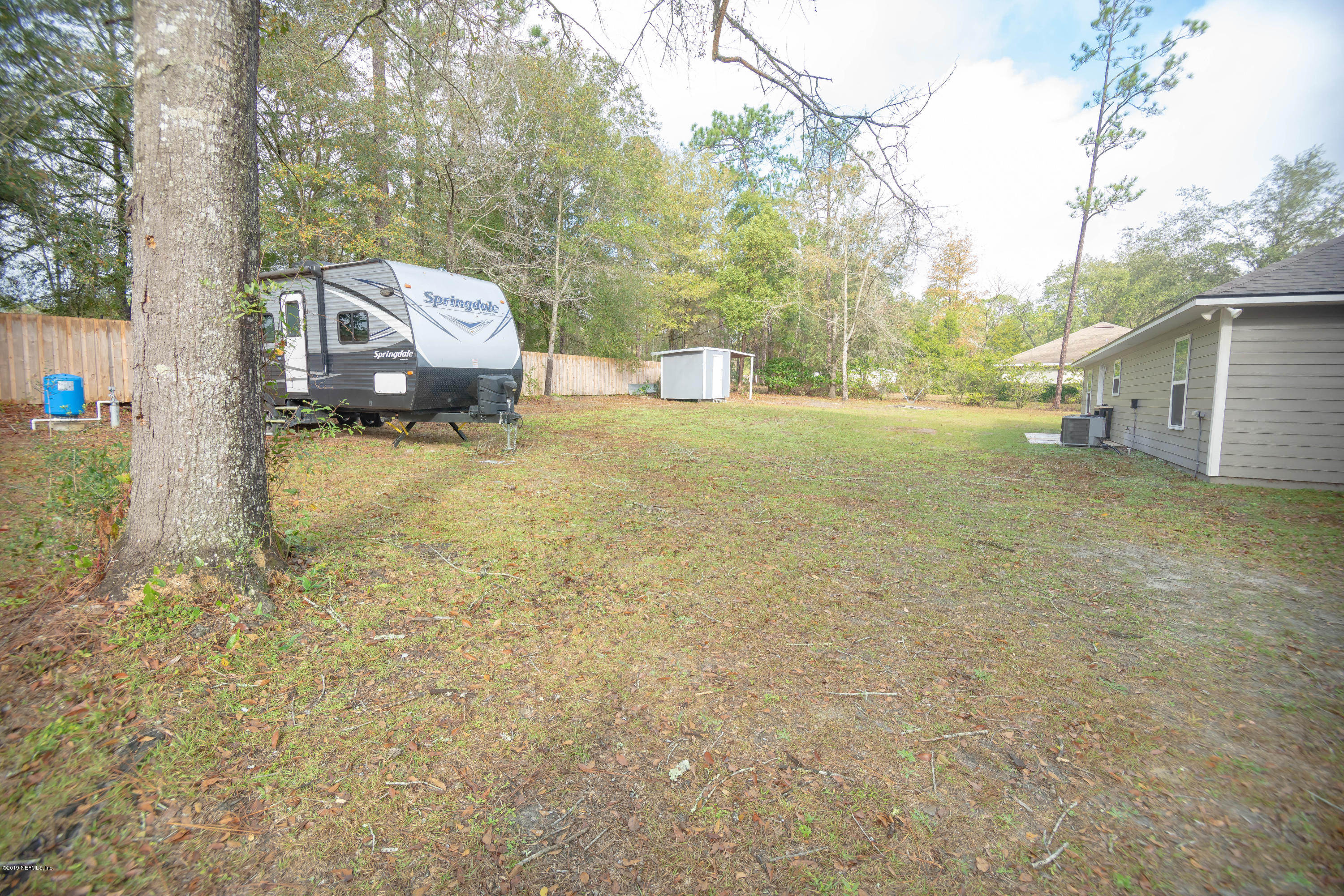 9964 River Oak Circle Glen St. Mary, FL 32040 - Photo 30 of 41 a view of a house with a yard