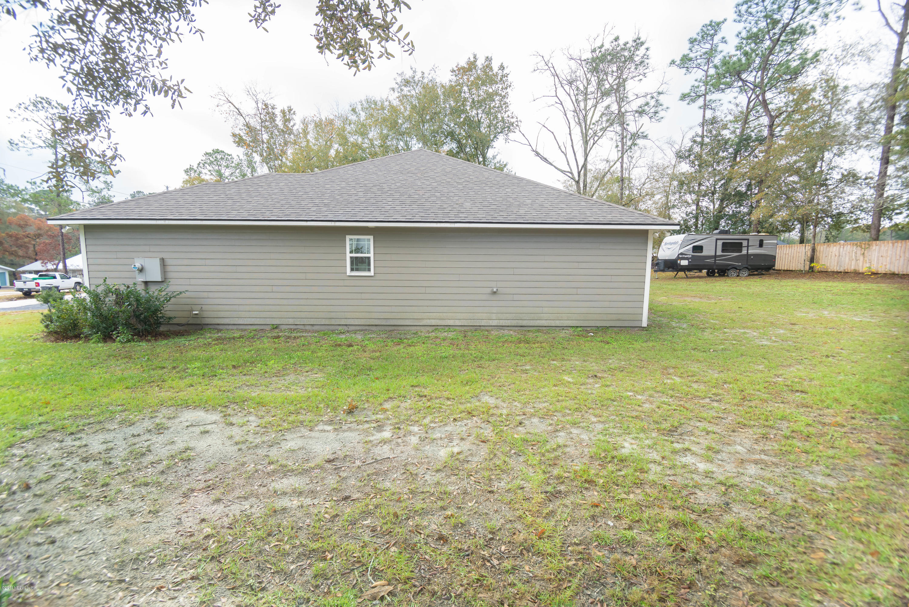 9964 River Oak Circle Glen St. Mary, FL 32040 - Photo 36 of 41 a front view of house with yard and trees