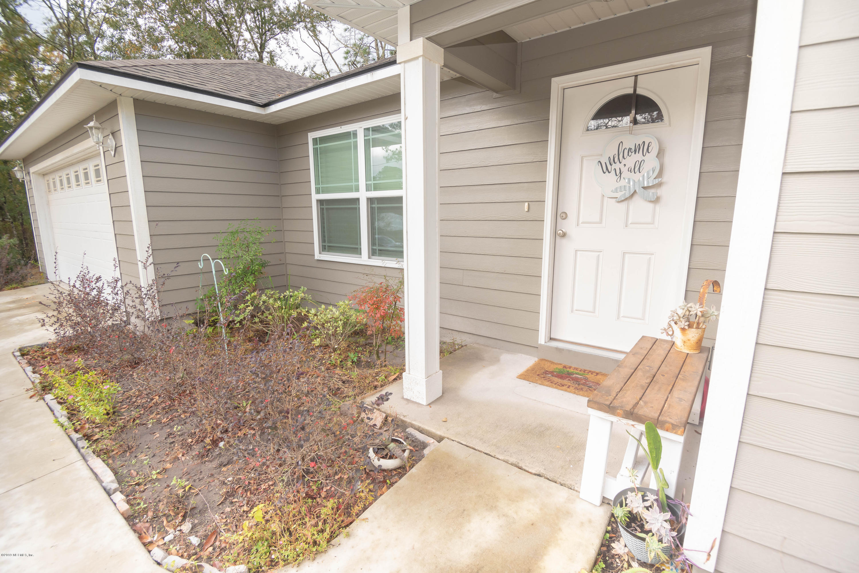 9964 River Oak Circle Glen St. Mary, FL 32040 - Photo 40 of 41 a view of a porch with seating space