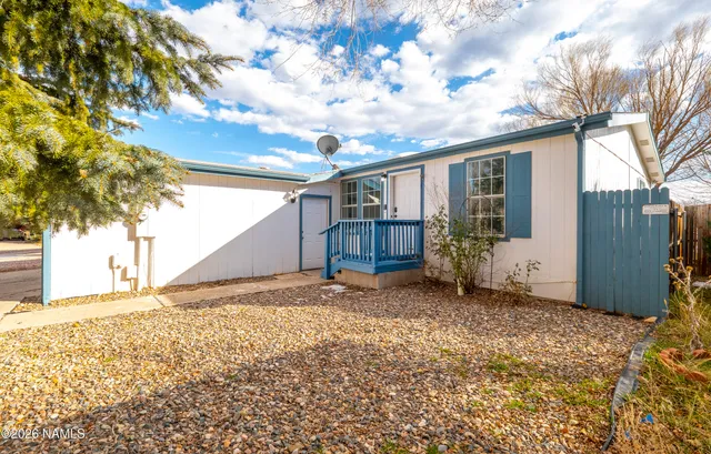 a view of a house with a snow in the yard