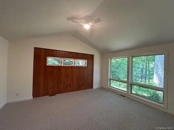 a kitchen with cabinets and wooden floor
