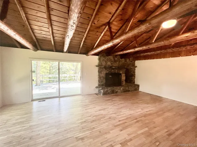a view of a two chairs in the balcony