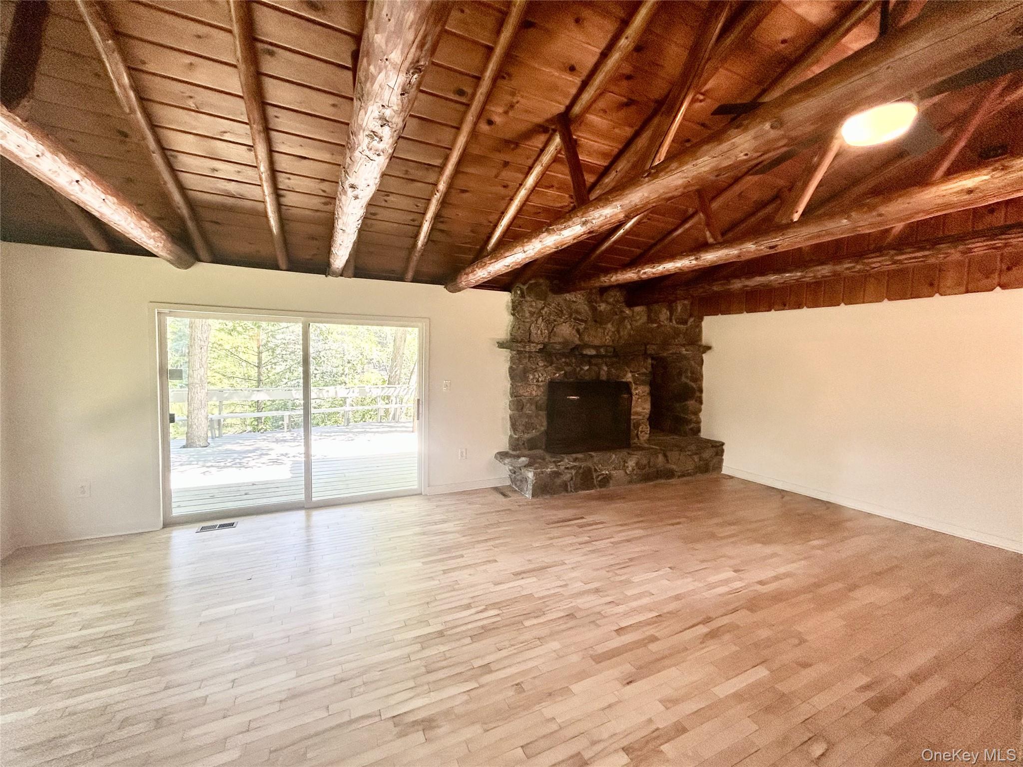 272 Drake Road Pleasant Valley, NY 12569 - Photo 28 of 43 a view of an empty room with wooden floor and a window