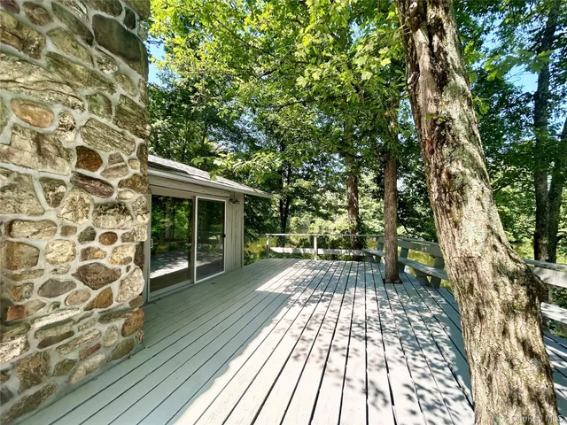 a view of house with backyard space
