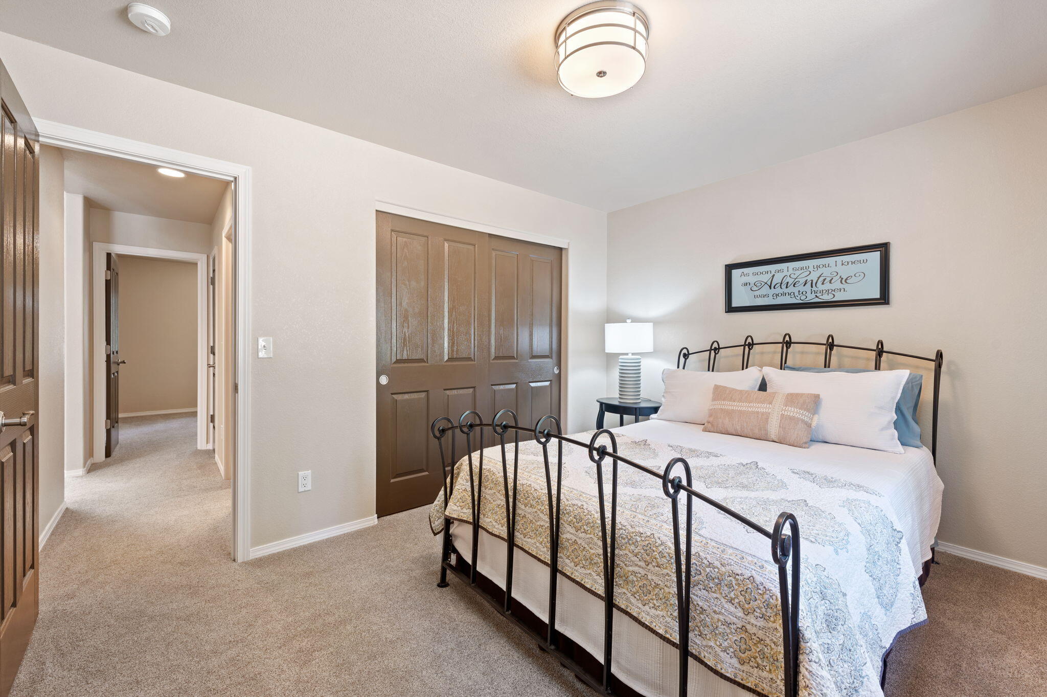 16938 Quartz Hill Road Bend, OR 97707 - Photo 30 of 52 a bedroom with a bed and painting on the wall
