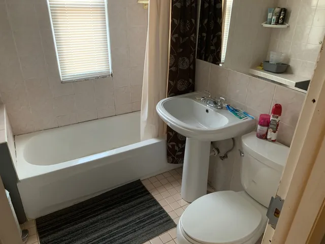 a bathroom with a sink toilet and bathtub