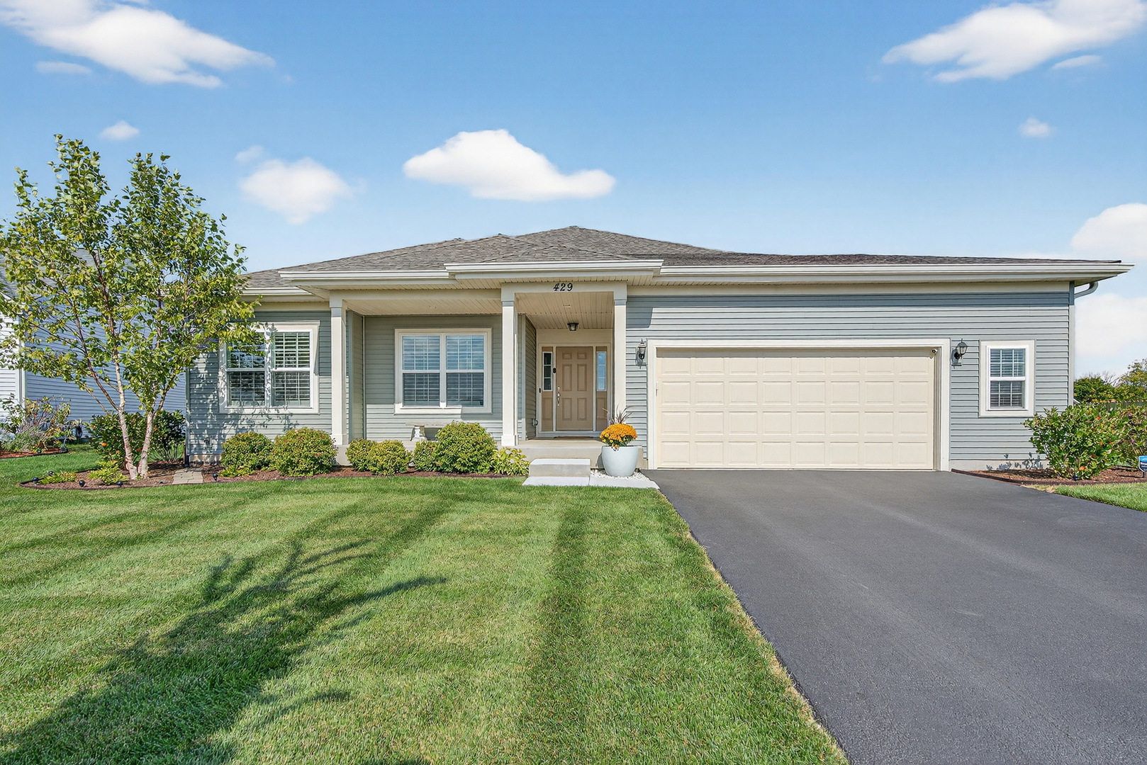 429 Fairway Lane Sycamore, IL 60178 - Photo 1 of 43 a front view of a house with a yard and garage