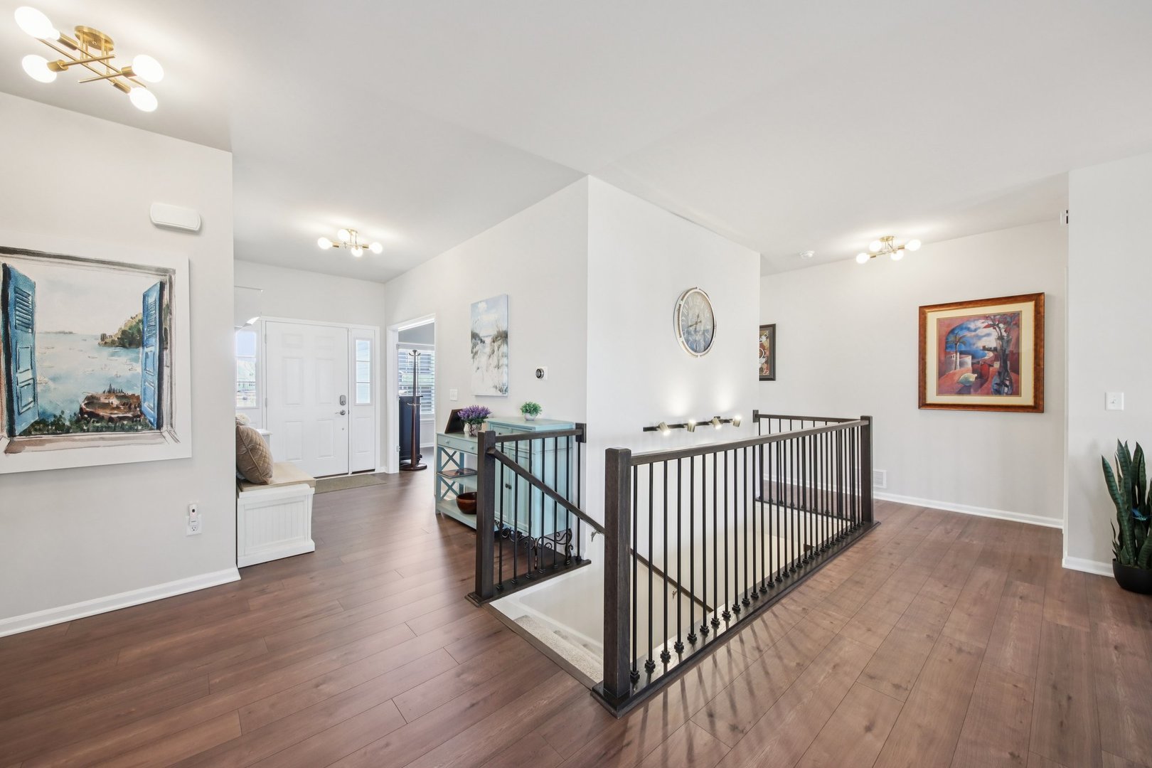 429 Fairway Lane Sycamore, IL 60178 - Photo 11 of 43 a view of a hallway with wooden floor and windows