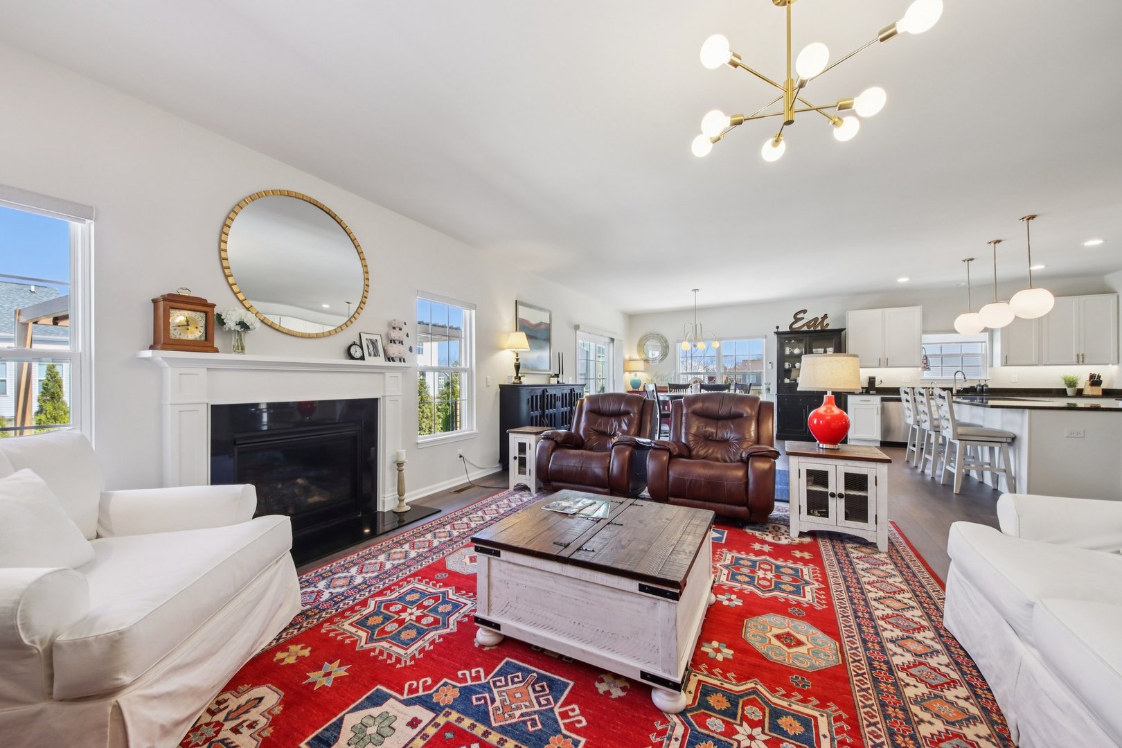 429 Fairway Lane Sycamore, IL 60178 - Photo 2 of 43 a living room with furniture a fireplace and a chandelier