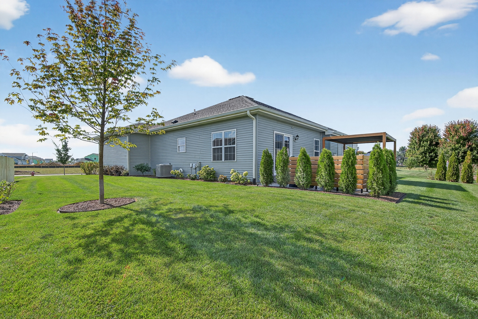 429 Fairway Lane Sycamore, IL 60178 - Photo 32 of 43 a view of a house with yard and tree s