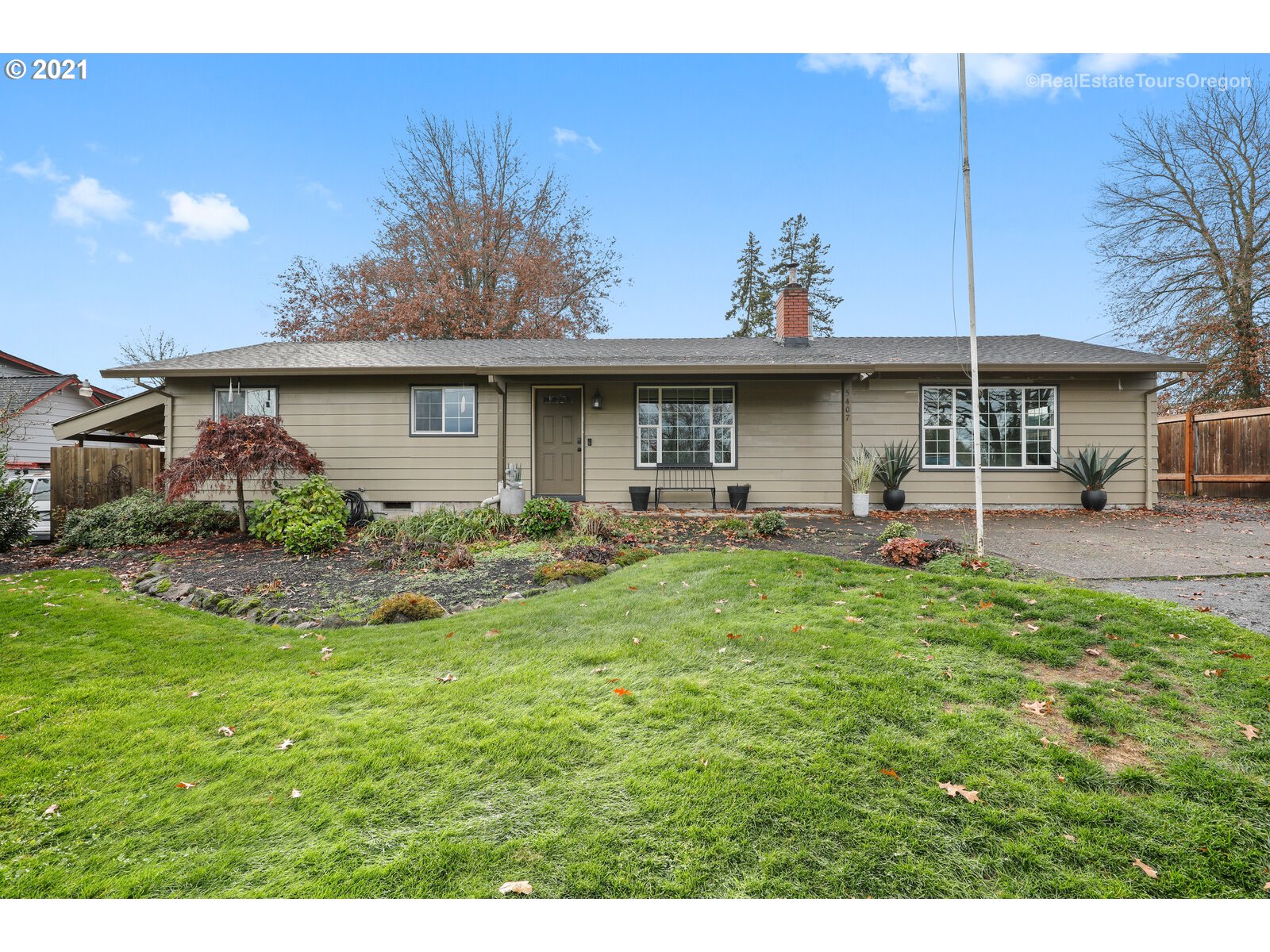 5407 Southwest Spring Hill Road Gaston, OR 97119 - Photo 1 of 25 a front view of house with yard and outdoor seating