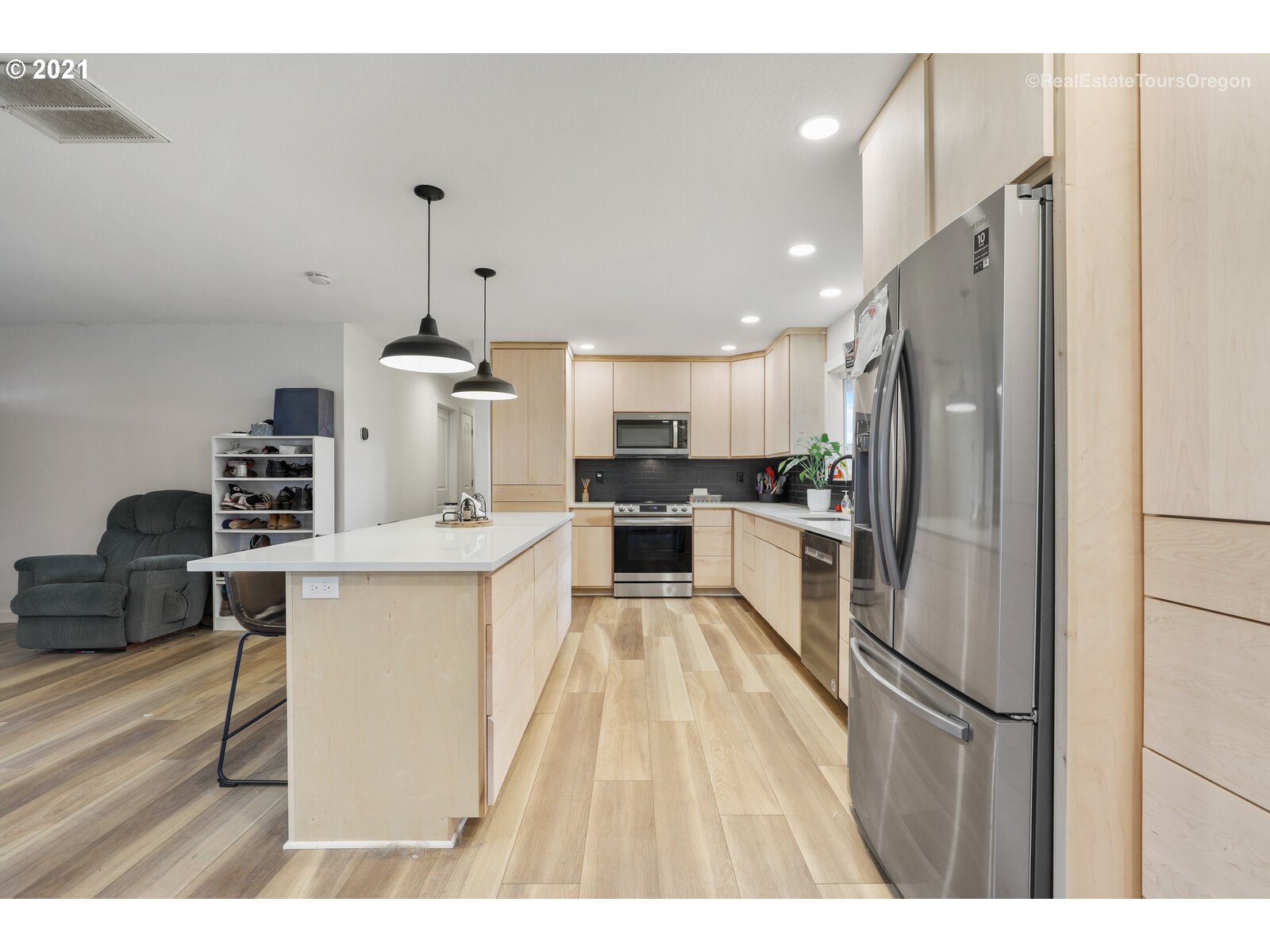 5407 Southwest Spring Hill Road Gaston, OR 97119 - Photo 6 of 25 a kitchen with kitchen island a white counter top space stainless steel appliances and cabinets