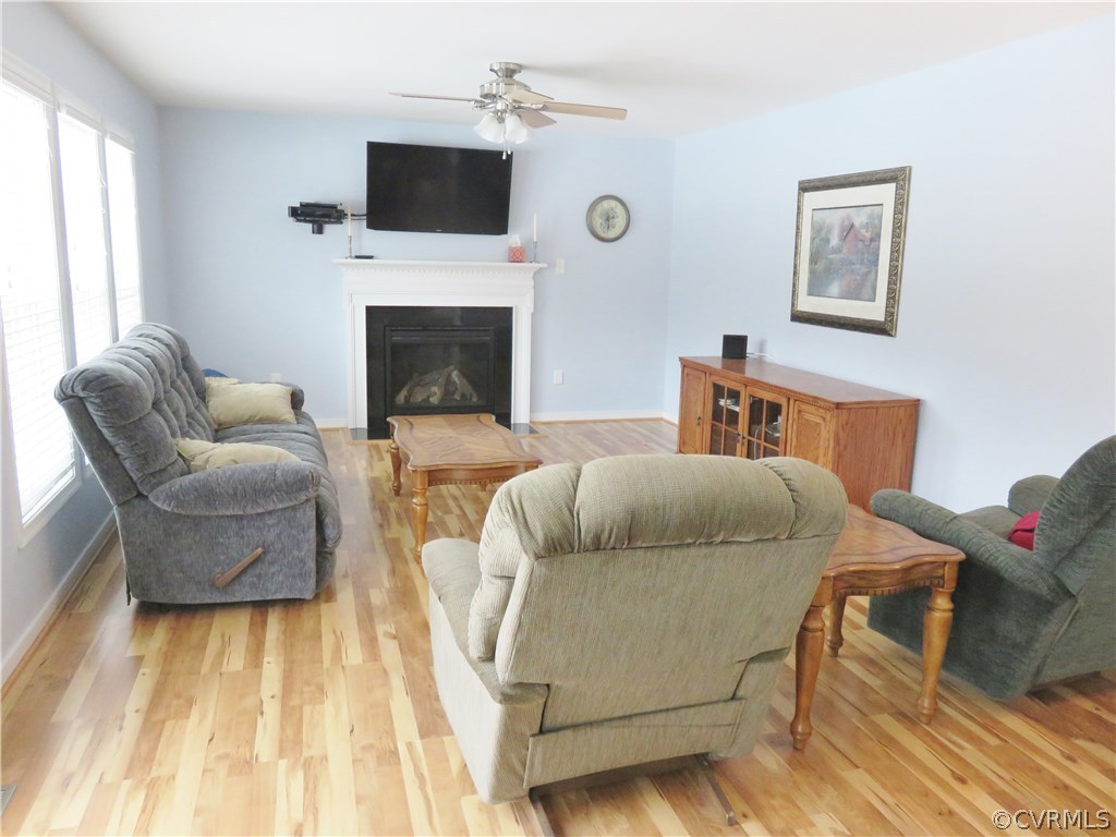 Bright family room with laminate flooring, firepla