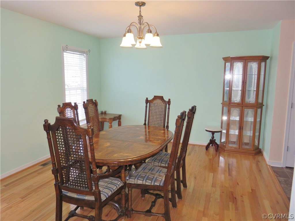 The foyer has columns and opens up to this formal