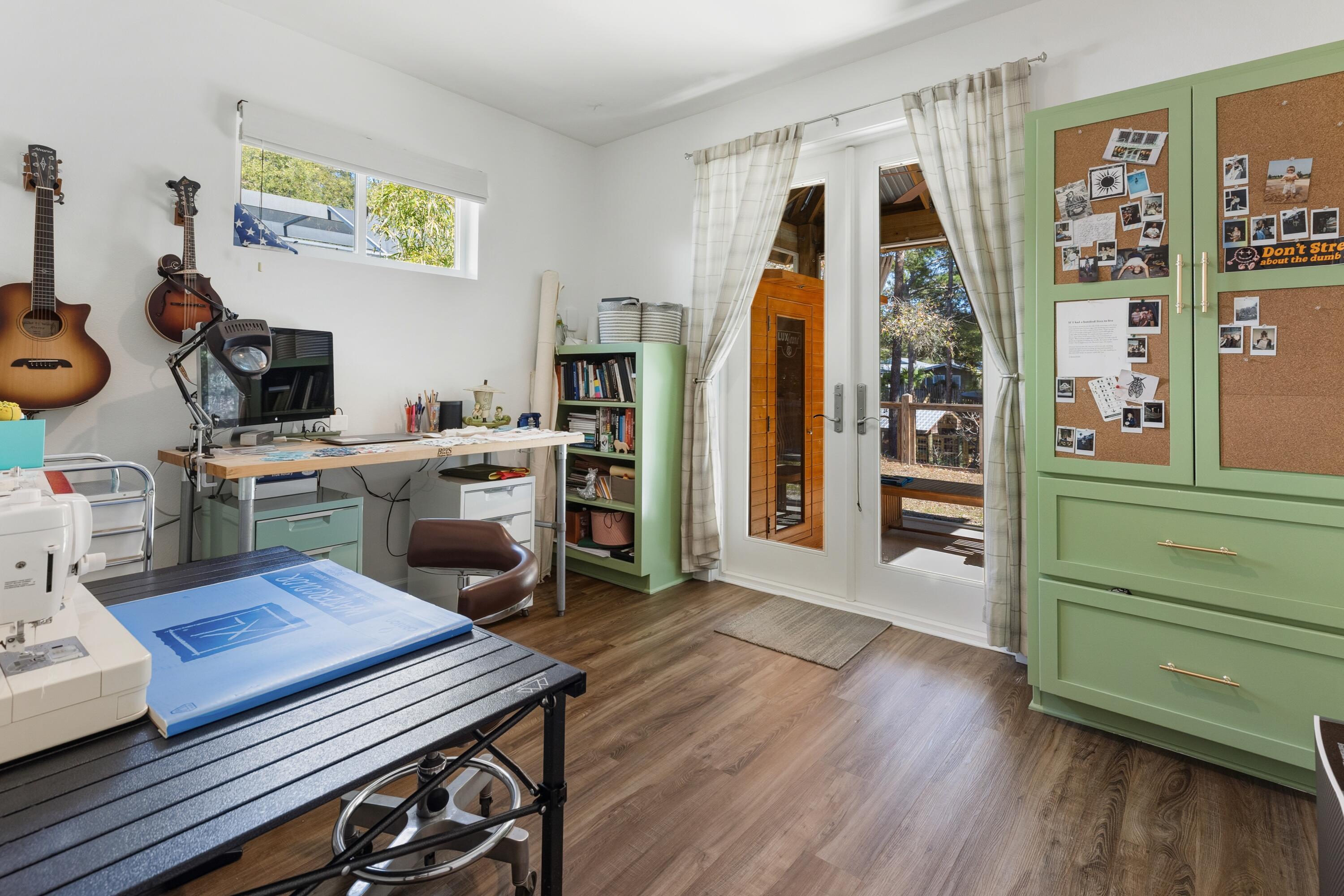 448 Ricker Avenue Santa Rosa Beach, FL 32459 - Photo 17 of 30 a view of a workspace with furniture and a window