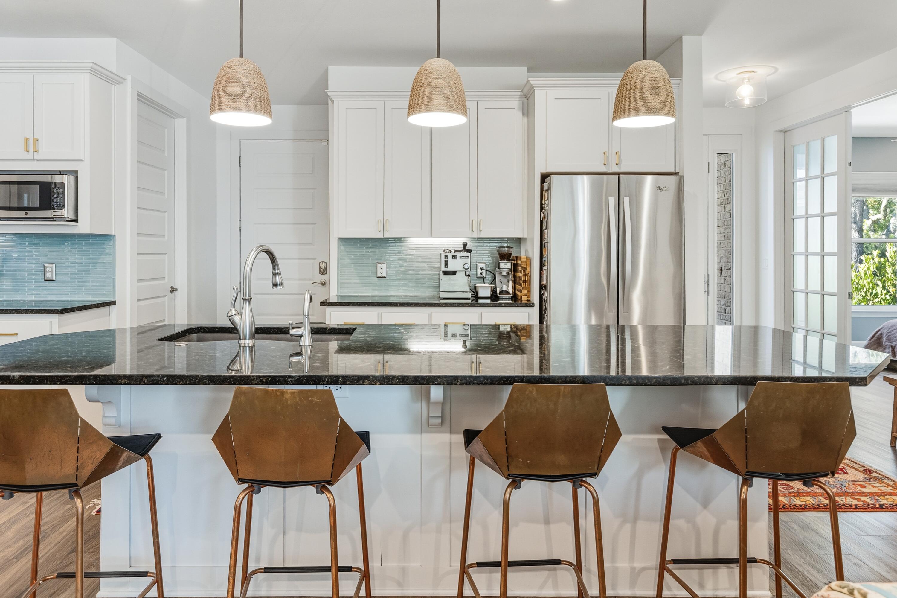 448 Ricker Avenue Santa Rosa Beach, FL 32459 - Photo 6 of 30 a kitchen with a dining table and chairs