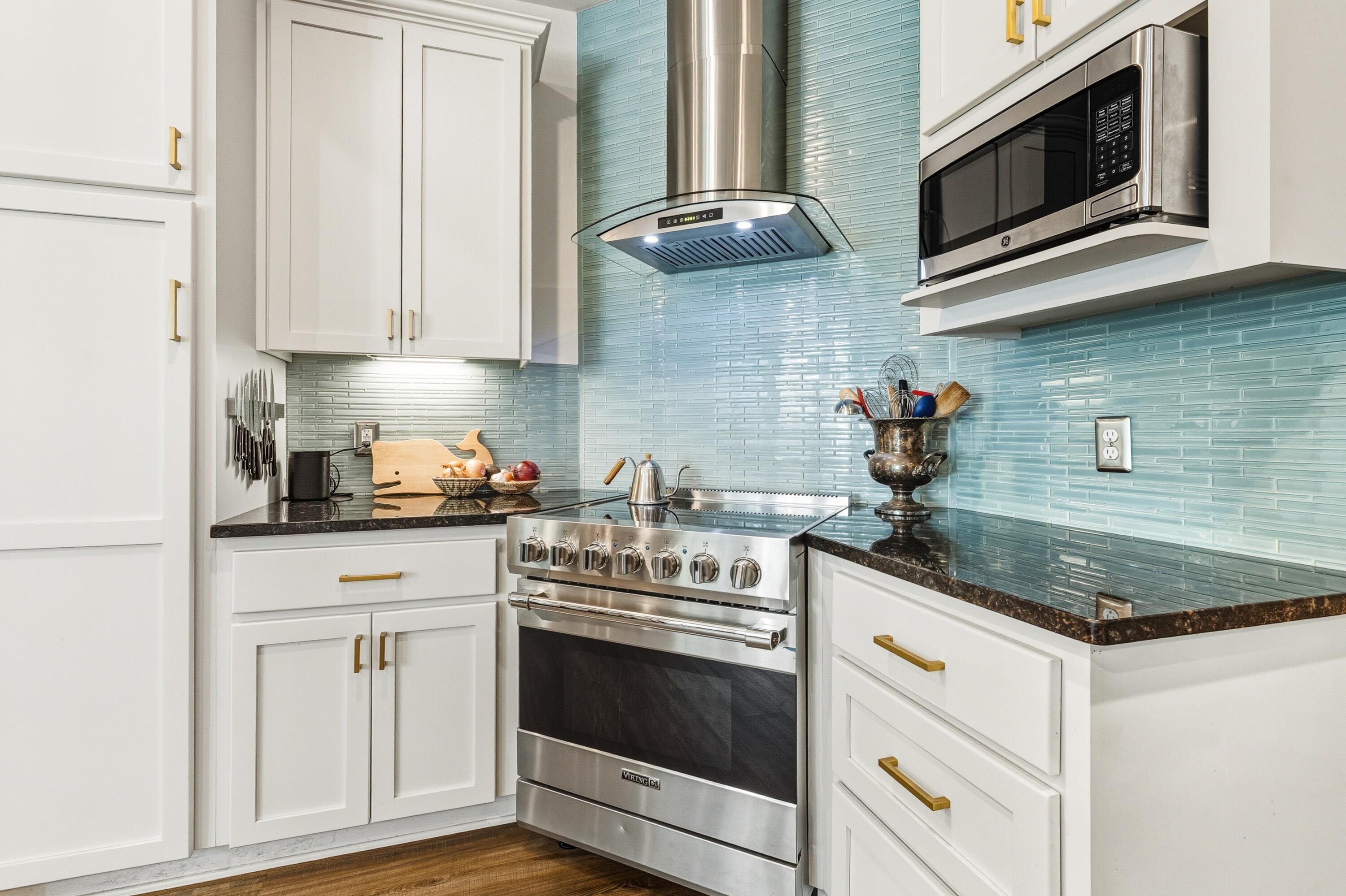 448 Ricker Avenue Santa Rosa Beach, FL 32459 - Photo 8 of 30 a kitchen with stainless steel appliances granite countertop a sink and a stove