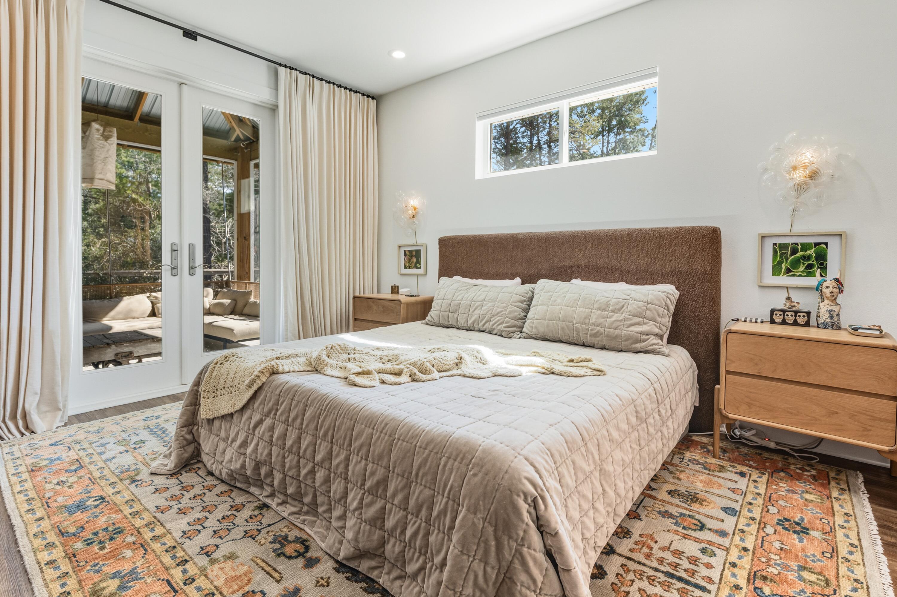 448 Ricker Avenue Santa Rosa Beach, FL 32459 - Photo 10 of 30 a bedroom with a large bed and a window