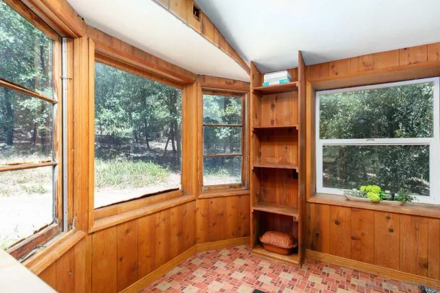 a living room with large windows