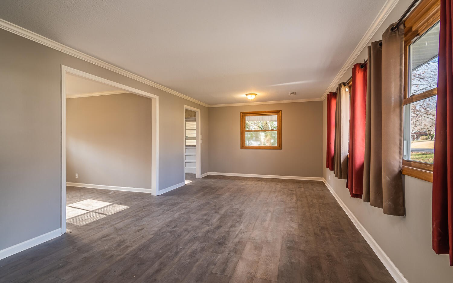 150 Beverly Circle Oak Ridge, TN 37830 - Photo 3 of 19 an empty room with wooden floor and windows
