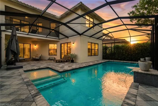 a view of a swimming pool with a patio