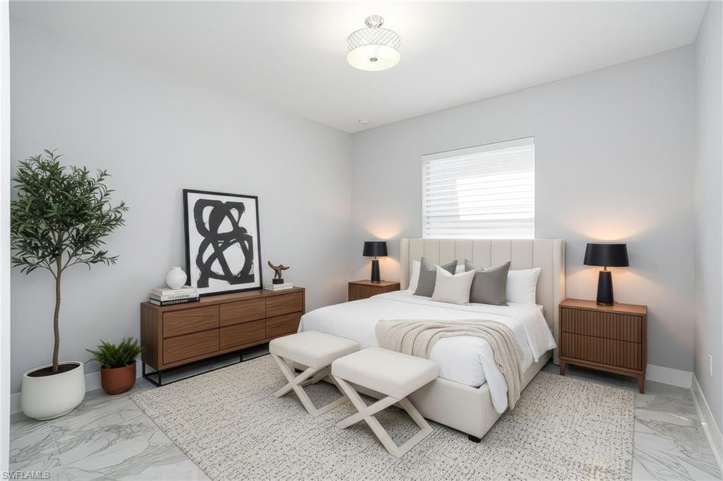 4654 Kensington Circle Naples, FL 34119 - Photo 28 of 48 a bedroom with a bed and a potted plant