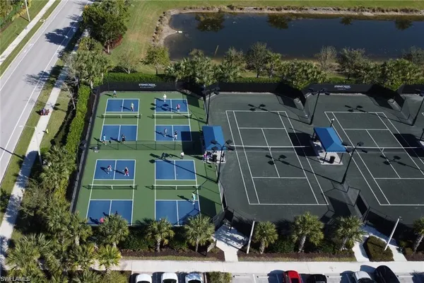a dining room with furniture a chandelier and a rug