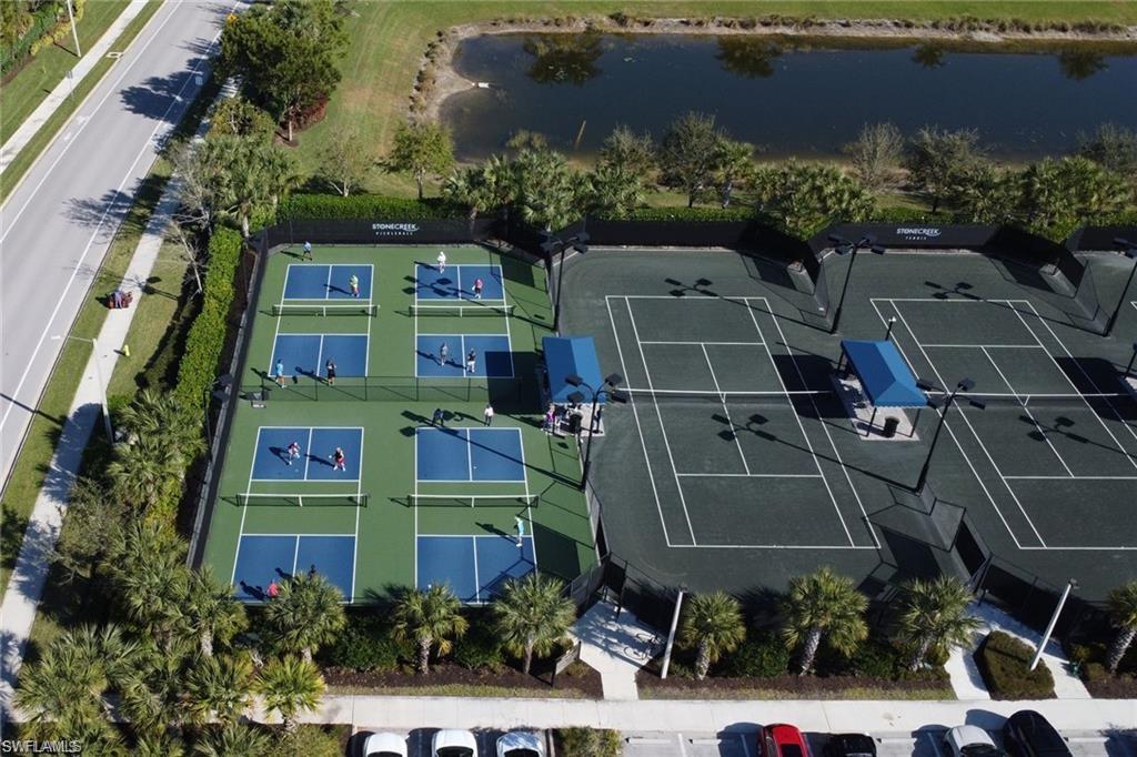 4654 Kensington Circle Naples, FL 34119 - Photo 39 of 48 an aerial view of multi story residential apartment building with green space