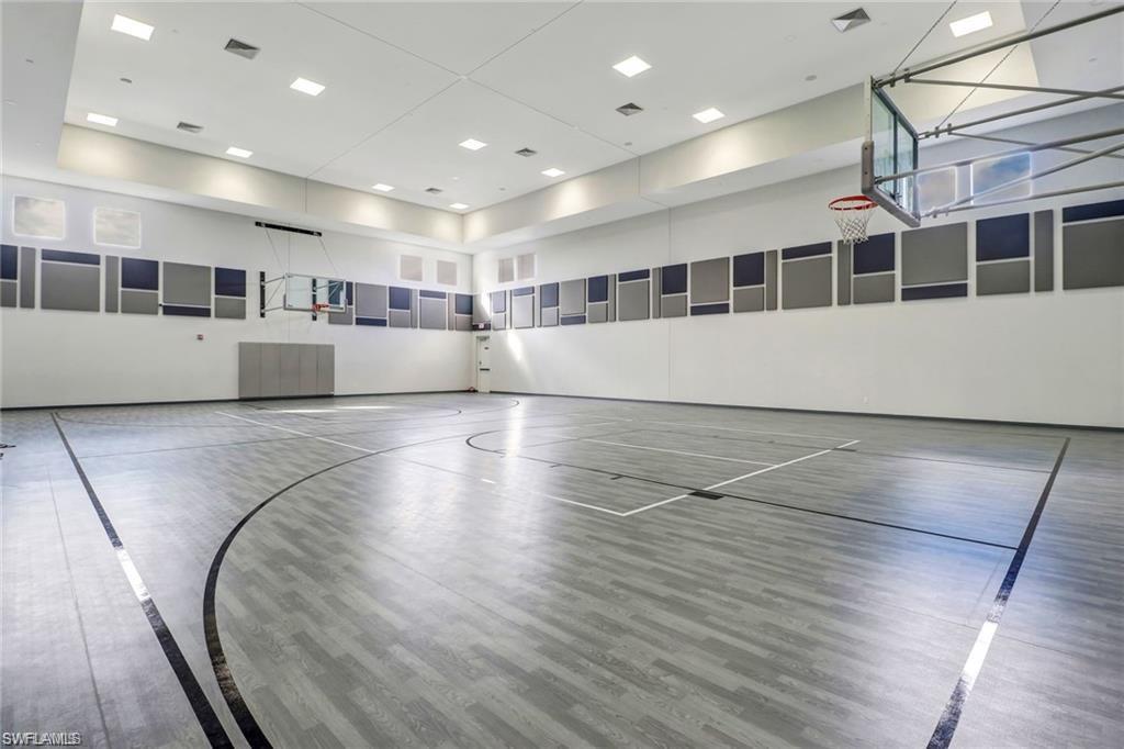 4654 Kensington Circle Naples, FL 34119 - Photo 45 of 48 a view of a large room with wooden floor