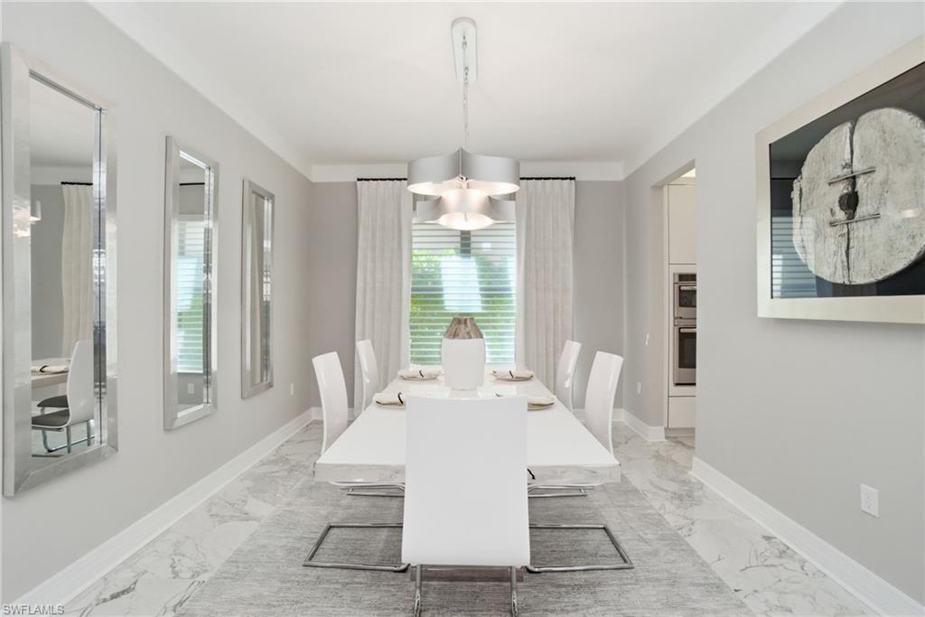 4654 Kensington Circle Naples, FL 34119 - Photo 9 of 48 a view of a dining room with furniture window and outside view