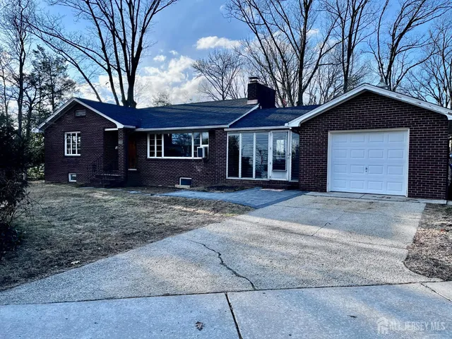 a kitchen with a sink and a refrigerator