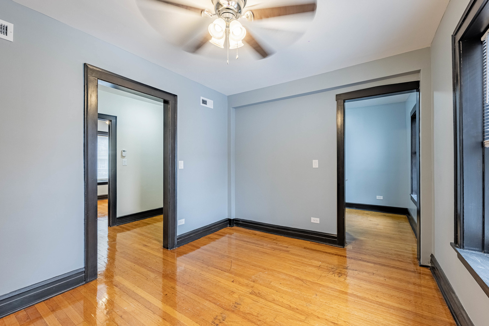 5805 South Whipple Street, Unit 1 Chicago, IL 60629 - Photo 10 of 15 a view of empty room with wooden floor