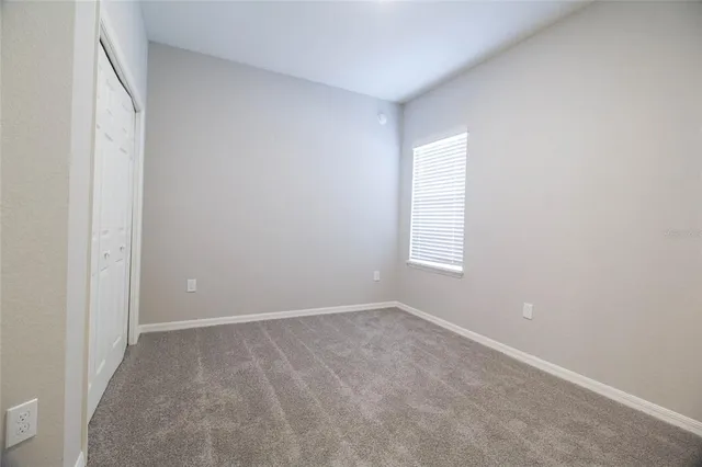 a white bath tub sitting next to a white toilet