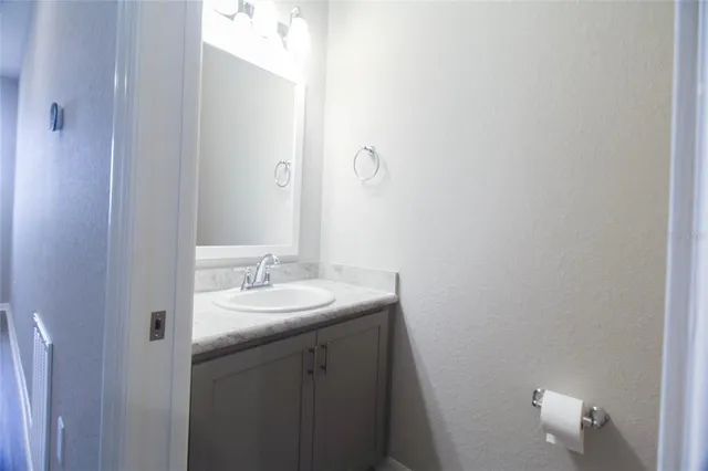a view of bathroom and hallway
