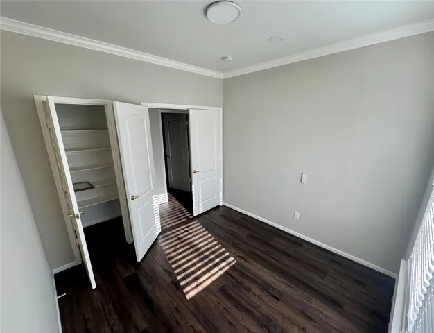 a kitchen with a refrigerator and a stove