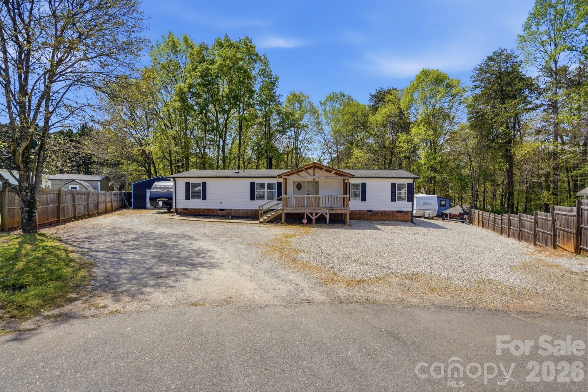 605 Ridgewood Court Mount Holly, NC 28120 - Photo 32 of 32 a front view of a house with a yard and a garage