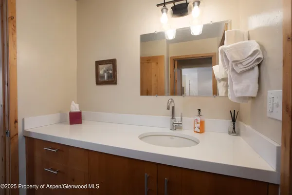 a bathroom with a sink and a mirror