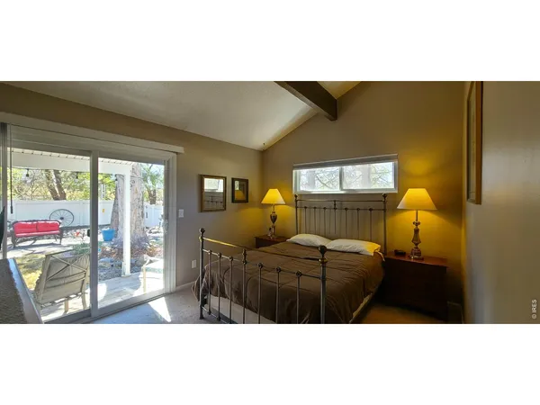 a bedroom with furniture and window