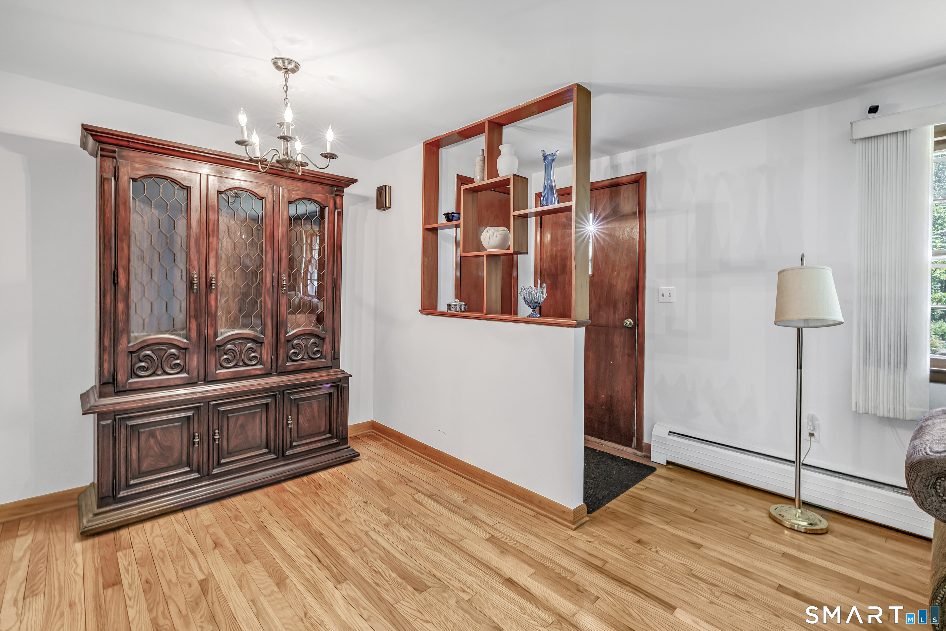 223 Wheeler Road Monroe, CT 06468 - Photo 4 of 35 a view of a hallway with wooden floor and staircase