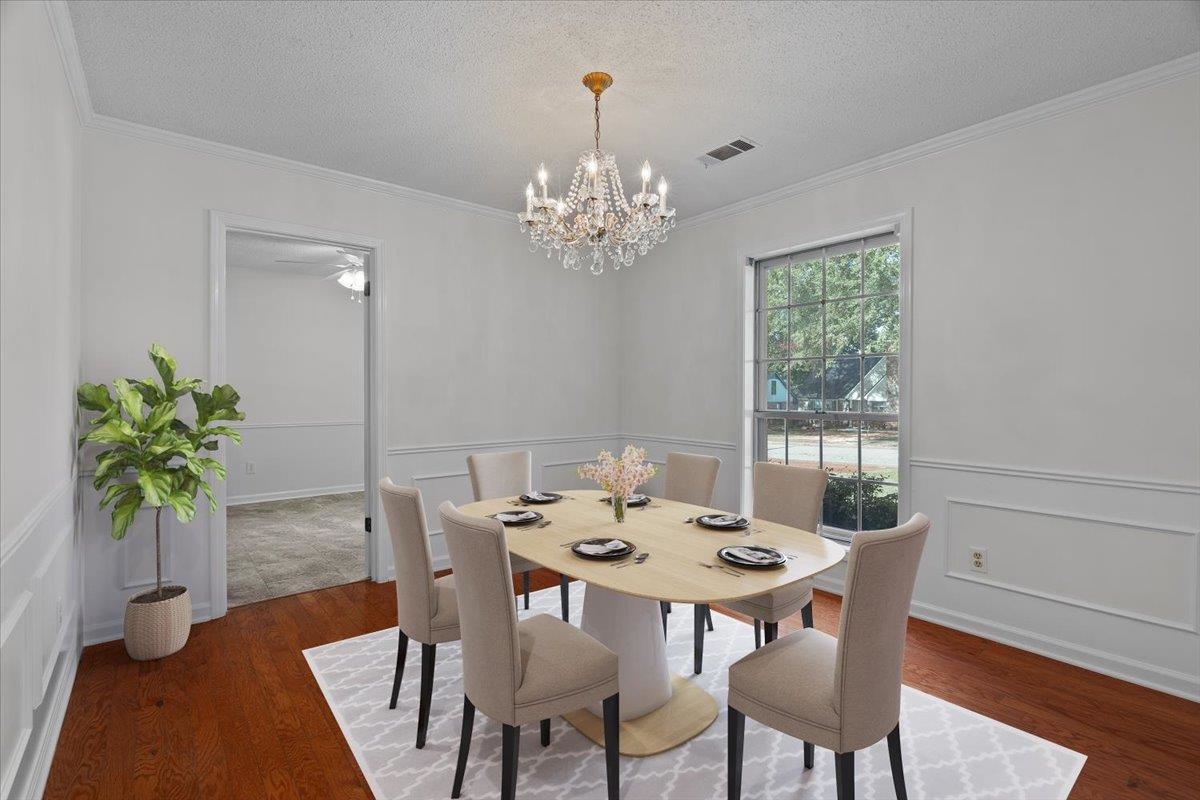369 Taraview Road Collierville, TN 38017 - Photo 15 of 34 a view of a dining room with furniture a chandelier and wooden floor