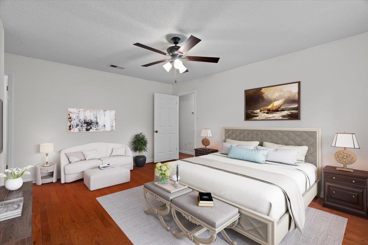 369 Taraview Road Collierville, TN 38017 - Photo 17 of 34 a bedroom with furniture and a flat screen tv