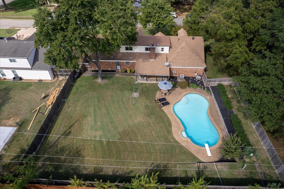 369 Taraview Road Collierville, TN 38017 - Photo 2 of 34 an aerial view of a house with a swimming pool and large trees