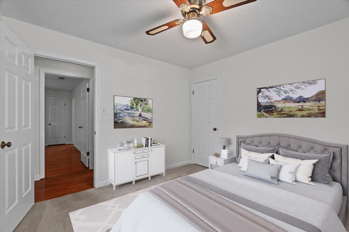 369 Taraview Road Collierville, TN 38017 - Photo 21 of 34 Carpeted bedroom with a textured ceiling and ceiling fan