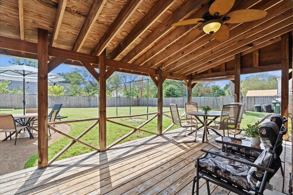 369 Taraview Road Collierville, TN 38017 - Photo 30 of 34 a view of a patio with wooden floor chairs and table