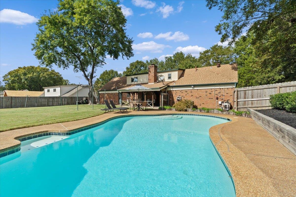 369 Taraview Road Collierville, TN 38017 - Photo 4 of 34 a view of a house with pool and a yard