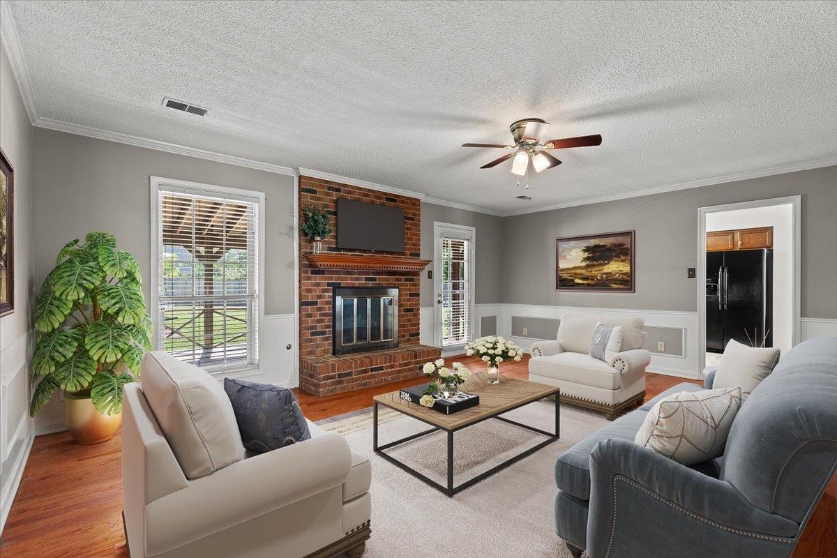 369 Taraview Road Collierville, TN 38017 - Photo 7 of 34 a living room with furniture a chandelier and a window