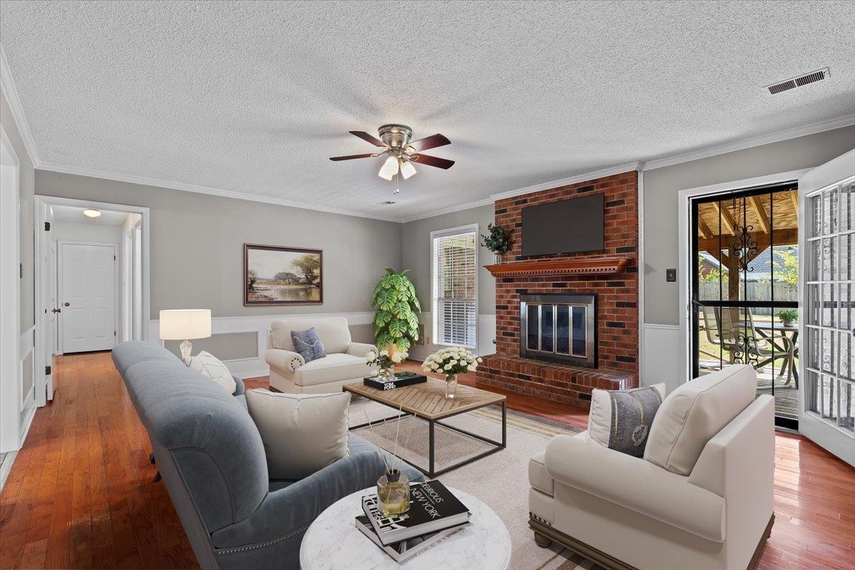 369 Taraview Road Collierville, TN 38017 - Photo 8 of 34 a living room with furniture a fireplace and a flat screen tv